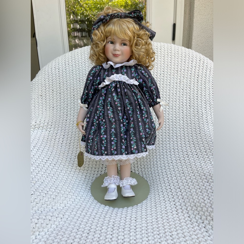 Porcelain doll from the Wimbledon Collection and stand included